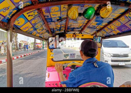 Tuk-tuks are three-wheeled open vehicles that are popular in Thai cities. Inside a tuk tuk in Bangkok, Thailand - 20 January 2020 Stock Photo