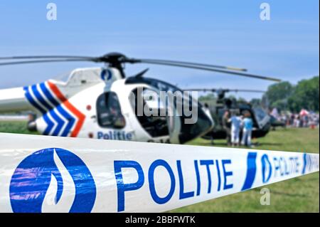 Politie / police tape in front of Belgian police helicopter, Belgium Stock Photo