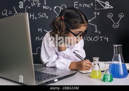 Elementary school girl taking computer class Stock Photo - Alamy