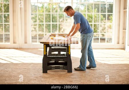 Businessman and builder discussing a construction project. Stock Photo