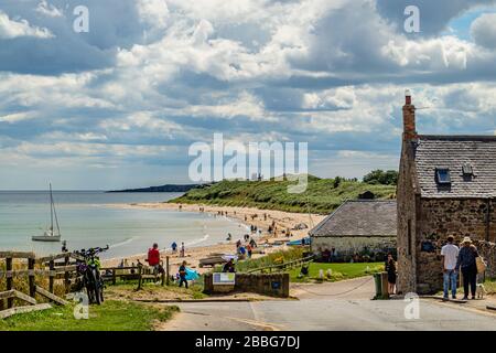 A summer's day on the beach at Low Newton-by-the-Sea, Northumberland, UK. August 2018. Stock Photo