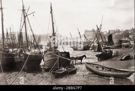 Fishing boats beached in Scarborough harbour, North Yorkshire, England.  Photographed in the late 19th century, possibly by English photographer Francis Frith, 1822 - 1898. Stock Photo