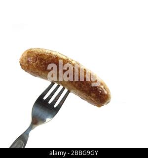 Fried sausage is skewered on a fork Stock Photo