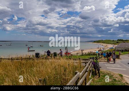 A summer's day by the sea at Low Newton-by-the-Sea, Northumberland, UK. August 2018. Stock Photo