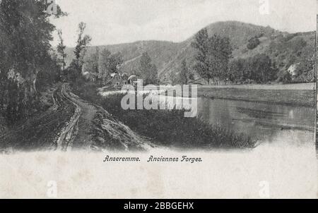 vintage postcard from around 1900 showing the Anciennes (old) forges along the Meuse river in Anseremme, Ardennes Belgium Stock Photo