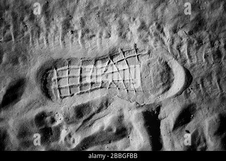 Footprint in field sand, symbols and signs Stock Photo