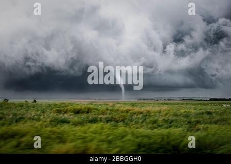Tornado touches down over a rural field near Hays Kansas United States Stock Photo