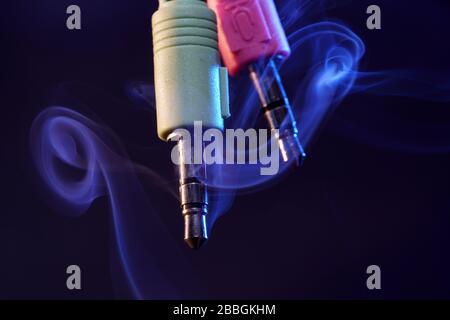 Electric wires with smoke photographed in the studio Stock Photo