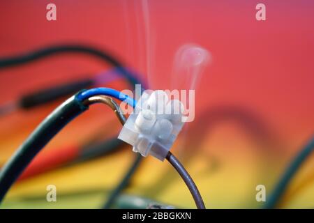 Electric wires with smoke photographed in the studio Stock Photo