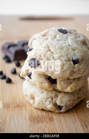 Homemade chocolate chip cookies and dark chocolate in the background Stock Photo