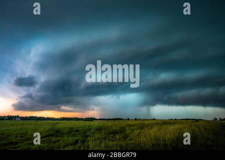 Storm dumping over a field in Oklahoma, United States Stock Photo
