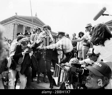 Photograph of Sylvester Stallone filming Rocky III in Philadelphia, PA in 1982.Credit:  Scott Weiner / MediaPunch Stock Photo