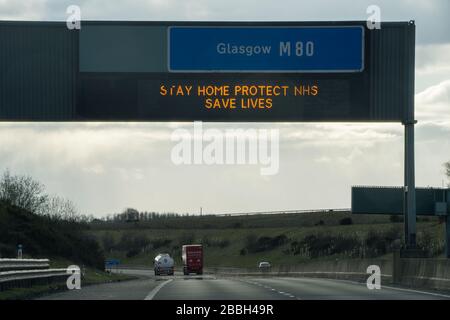 Cumbernauld, Scotland, UK. 31st Mar, 2020. Pictured: Motorway signs display the message, “STAY HOME PROTECT NHS SAVE LIVES” during the UK lockdown to stop the spread of the Coronavirus in which 1,993 people have now tested positive for the virus and 60 people have died from the virus. Credit: Colin Fisher/Alamy Live News Stock Photo