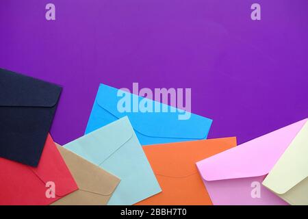 Different colored envelopes on the table with copy space Stock Photo