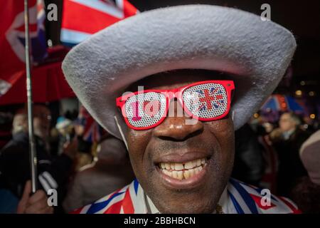 Brexit eve 31st of January 2020.  Pro Brexit supporters celebrate the final hours of being in the EU as the clock counts down to the United Kingdom leaving the European Union.  Pictured, pro Brexit supporter Joseph Afrane, wearing a Union Jack suit, Union Jack hat and Union Jack sunglasses.          by Gavin Crilly Photography, NO SALES, NO SYNDICATION contact for more information mob: 07810638169 web: www.pressphotographergloucestershire.co.uk email: gavincrilly@gmail.com    The photographic copyright (© 2015) is exclusively retained by the works creator at all times and sales, syndication or Stock Photo