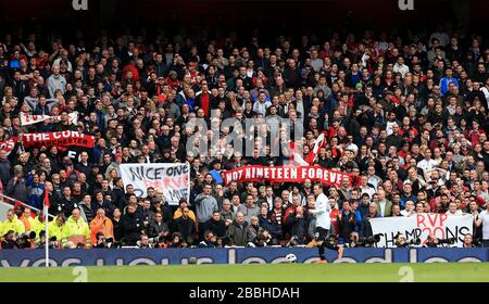 Manchester United fans in the stands hold up banners celebrating their 20 league titles Stock Photo