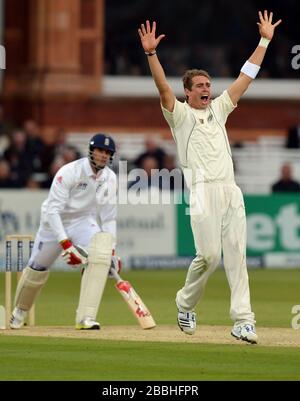 New Zealand's Tim Southee celebrates taking the wicket of England's Steven Finn (left) lbw for 4 during the first test at Lord's Cricket Ground, London. Stock Photo