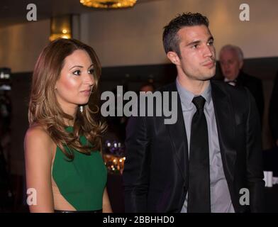 Robin Van Persie and his wife Bouchra during the PFA Player of the Year Awards 2013 at the Grosvenor House Hotel, London. Stock Photo