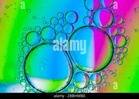 Abstract Background of Oil Bubbles on Water Surface colorful palette. Macro close-up shot. Stock Photo