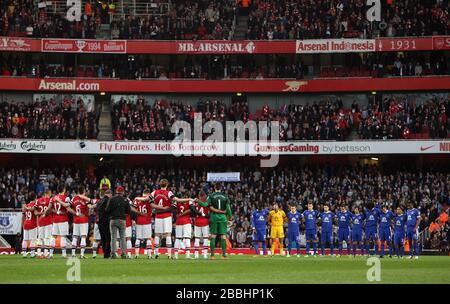 Arsenal and Everton observe the minutes silence before the game Stock Photo