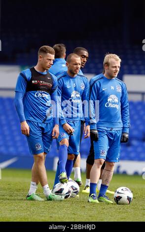 Everton's Ross Barkley, Johnny Heitinga and Steven Naismith (front left to right) during the open training day at Goodison Park Stock Photo