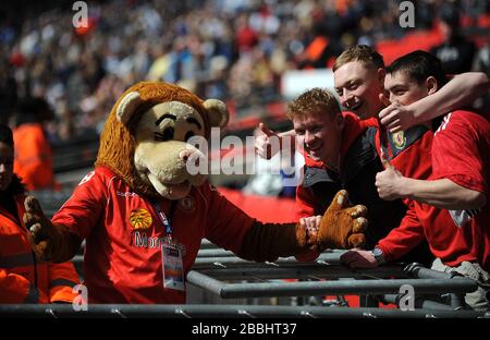 Crewe Alexandra mascot Gresty the Lion with fans before the kick off Stock Photo