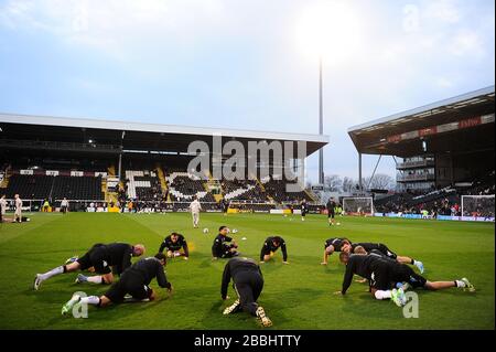 Fulham players warm up before the Premier League match at Tottenham