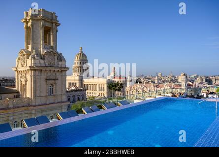 Rooftop view with  infinity pool of El Capitolio, or the National Capitol Building, and Museo Nacional de Bellas Artes, from roof of Gran Hotel Manzana Kempinski, Havana, Cuba