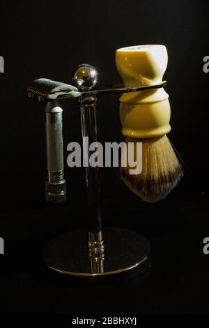Safety Razor and Shaving Brush on Holder on Black Background Stock Photo