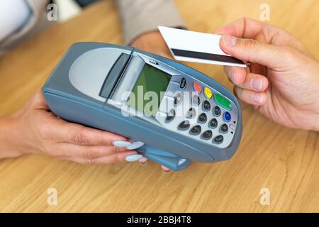 Paying through credit card reader Stock Photo