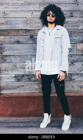 Portrait young handsome fashion bearded model man in urban. Afro Hairstyle. Stock Photo