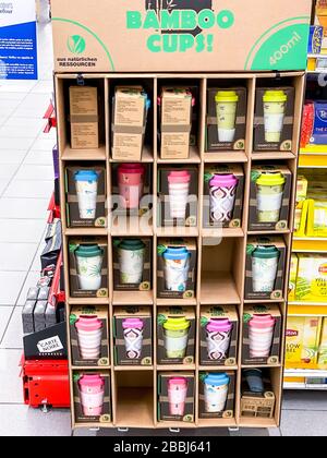 Bamboo cups, reusable hot drink cups in assortment in supermarket. Sustainable lifestyle concept. Plastic free, zero waste eco choice. Mobile photogra Stock Photo
