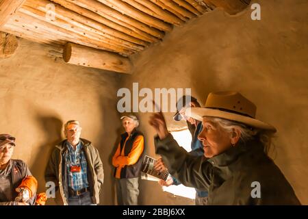 Ranger interpreting room details within Pueblo Bonito in Chaco Culture National Historical Park, New Mexico, USA [Note: no model releases; available f Stock Photo