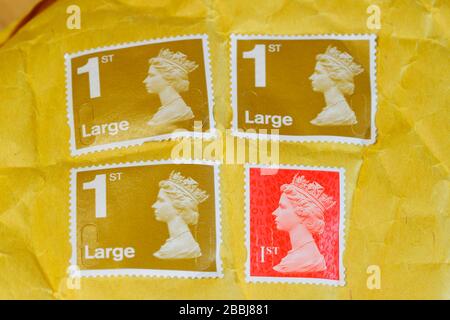 Stamps used to post a large parcel in the UK Stock Photo