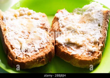 Cottage cheese toast on a green plate Stock Photo