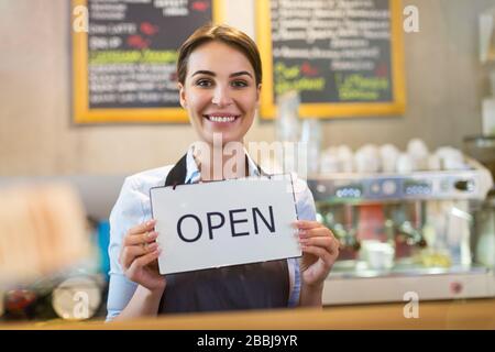 Woman working in coffee shop Stock Photo