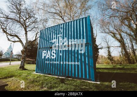 Strasbourg, France - Mar 18, 2020: Side low angle view of cargo containers painted in blue color and PAS signage from Port Autonome de Strasbourg Free Port near Robertsau neighborhood entrance Stock Photo