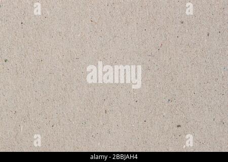 Texture of the vintage paper, cardboard, recyclable material with various villi, fluff and other inclusions, grunge background Stock Photo