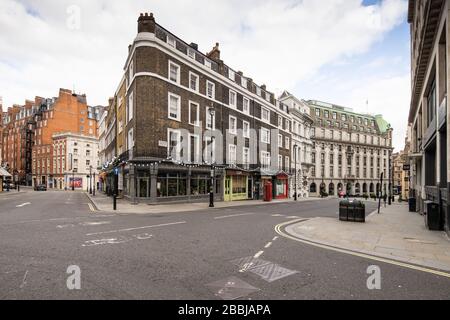 The normally busy junction of theatre land near Aldwych and the Strand appears empty during UK Coronavirus lockdown in London Stock Photo