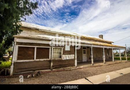 Front Of Old Abandoned Building In Disrepair Stock Photo