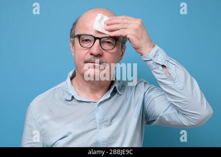 young businessman scratching his head has to do a hard decision Stock Photo