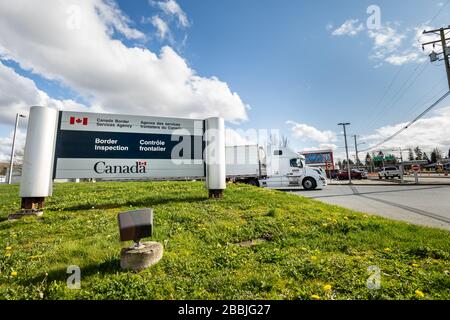Surrey, Canada - Mar 29, 2020: Freight truck exiting Canadian Border Services Agency Pacific Truck Crossing location during time of Coronavirus Covid- Stock Photo