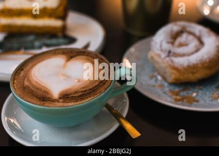 Coffee and pastries on a pub terrace. Close up image Stock Photo