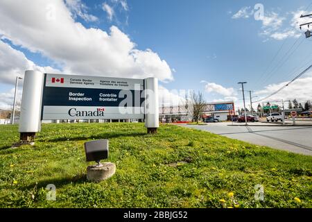 Surrey, Canada - Mar 29, 2020: Canadian Border Services Agency sign at entrance to Pacific Truck Crossing location during Coronavirus Covid-19 Canada Stock Photo