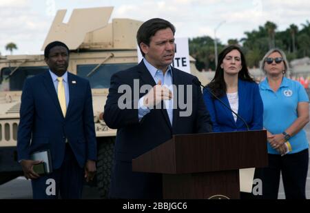 Florida Gov. Ron DeSantis holds a press conference at a Community Based COVID-19, coronavirus testing site at the Hard Rock Stadium March 30, 2020 in Miami Gardens, Florida. DeSantis has been criticized for his slow response to the pandemic and failure to impose strict guidelines on social distancing to prevent the spread of the virus. Stock Photo