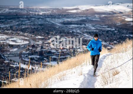 Male runner nearing the top of Mount Sentinel in Missoula MT. Stock Photo