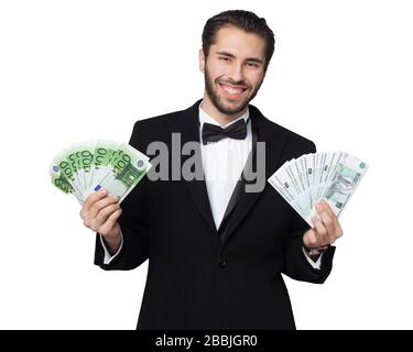 Shark of capitalism. Young male businessman is happy showing money, rubles and euros Stock Photo