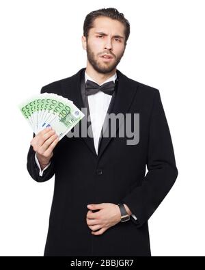 Shark of capitalism. Young business man cynically happy showing euro money. Rich. Stock Photo