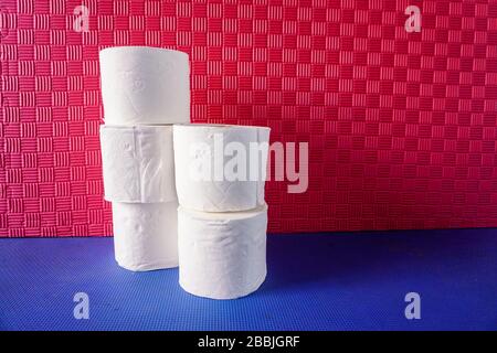 Stacked rolls of toilet paper representing hoarding because of Covid-19 Stock Photo