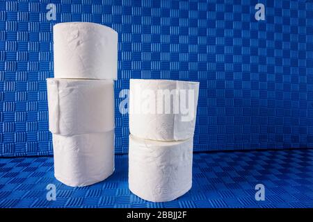 Stacked rolls of toilet paper representing hoarding because of Covid-19 Stock Photo